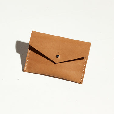 small, sleek tan leather card wallet